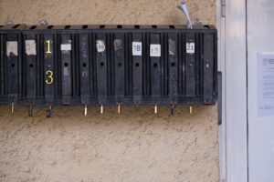 A bunch of electrical boxes hanging on a wall