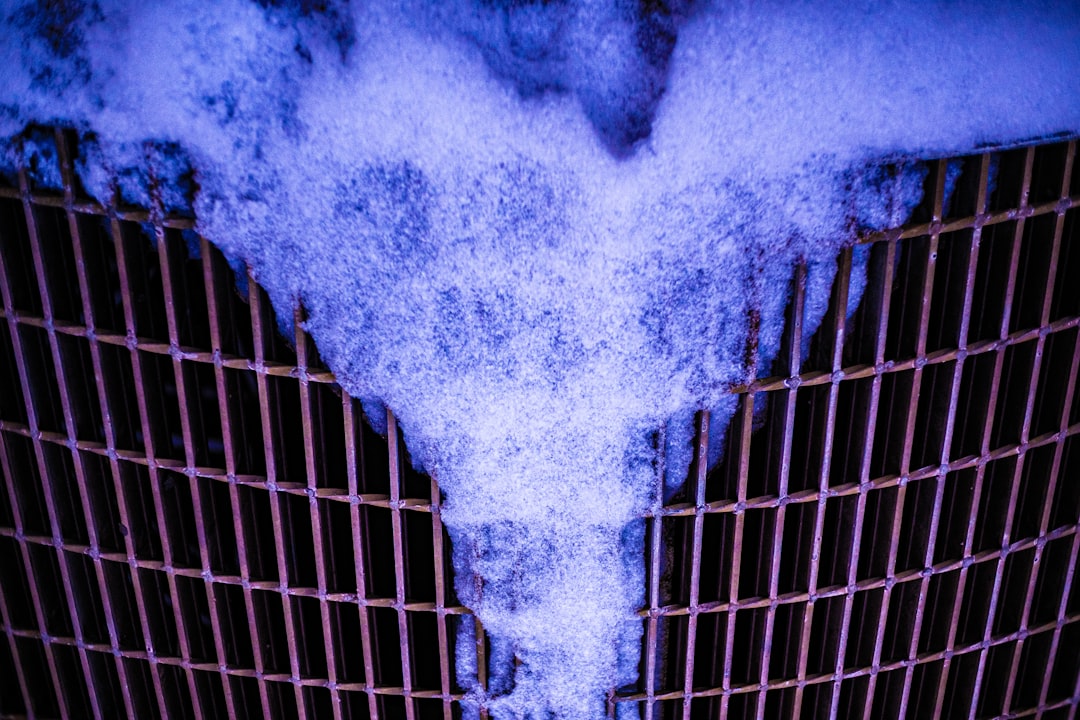 a heart shaped piece of metal with a lot of smoke coming out of it